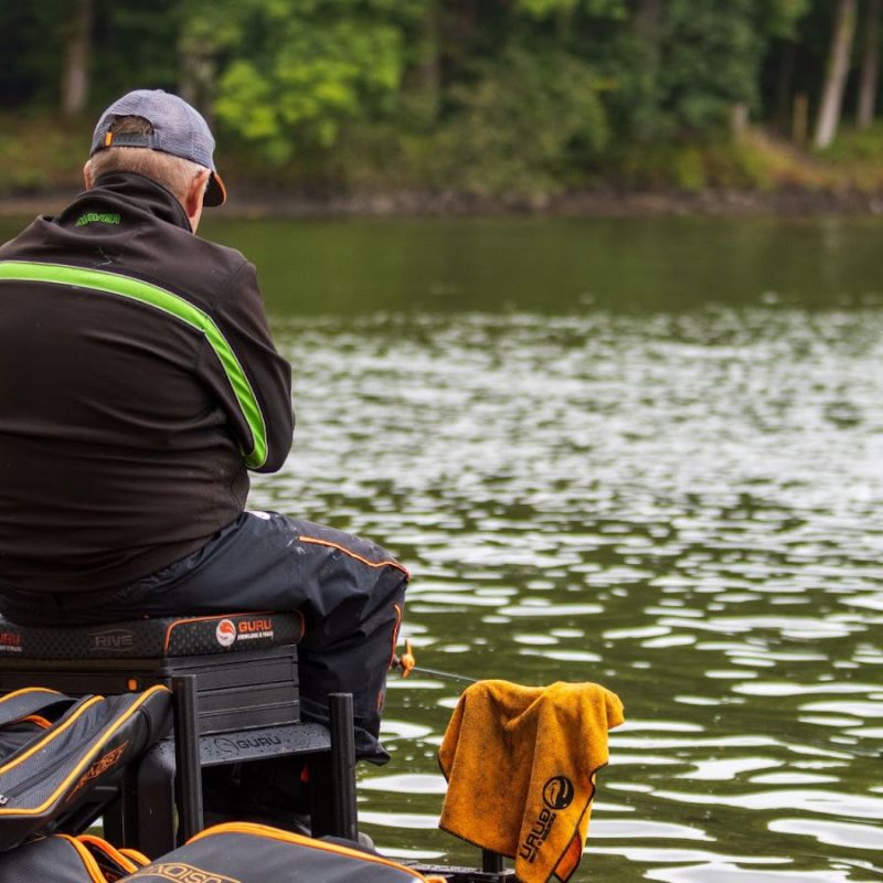 Angler competes in a match at a fishing lake.