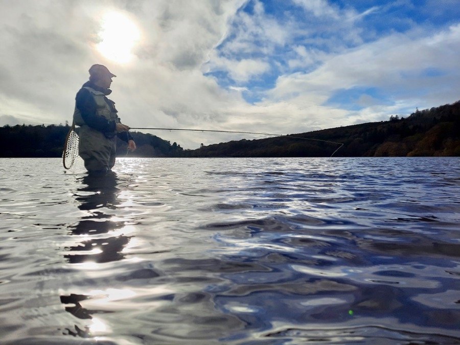 Sceneic image of a flyfisher in knee deep about to cast