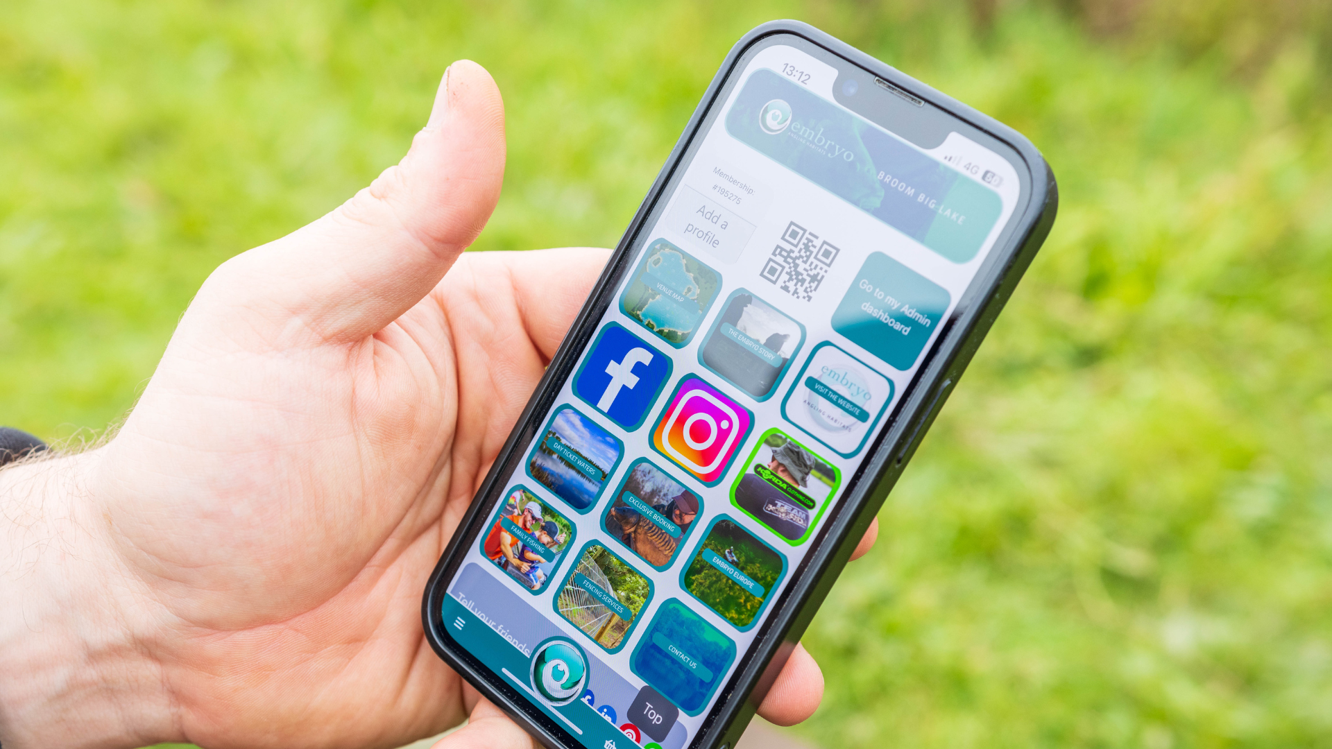 Smartphone in hand with Clubmate member app showing all the available tiles and tools