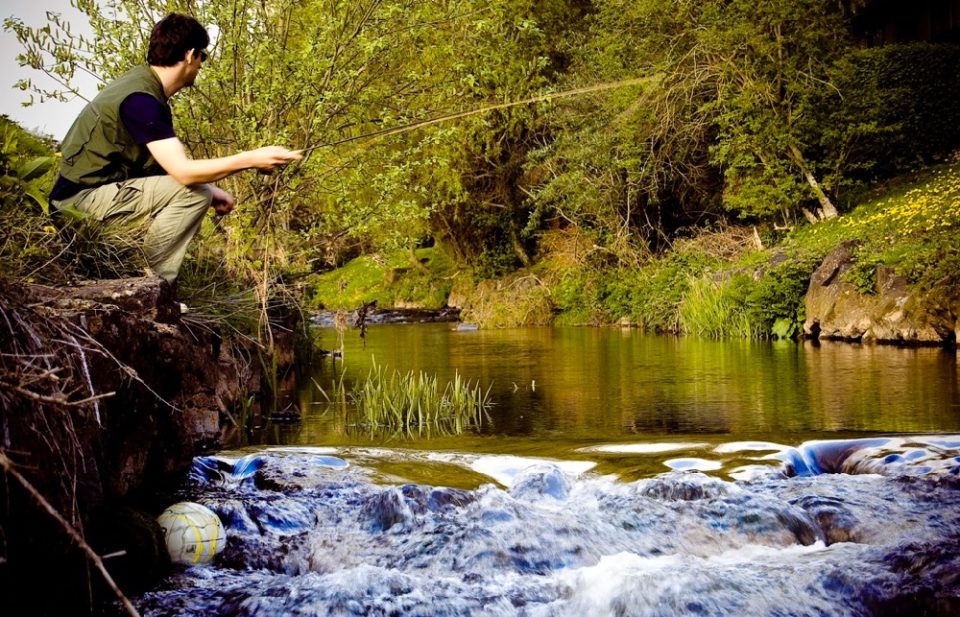 individual angler flyfishing on a river
